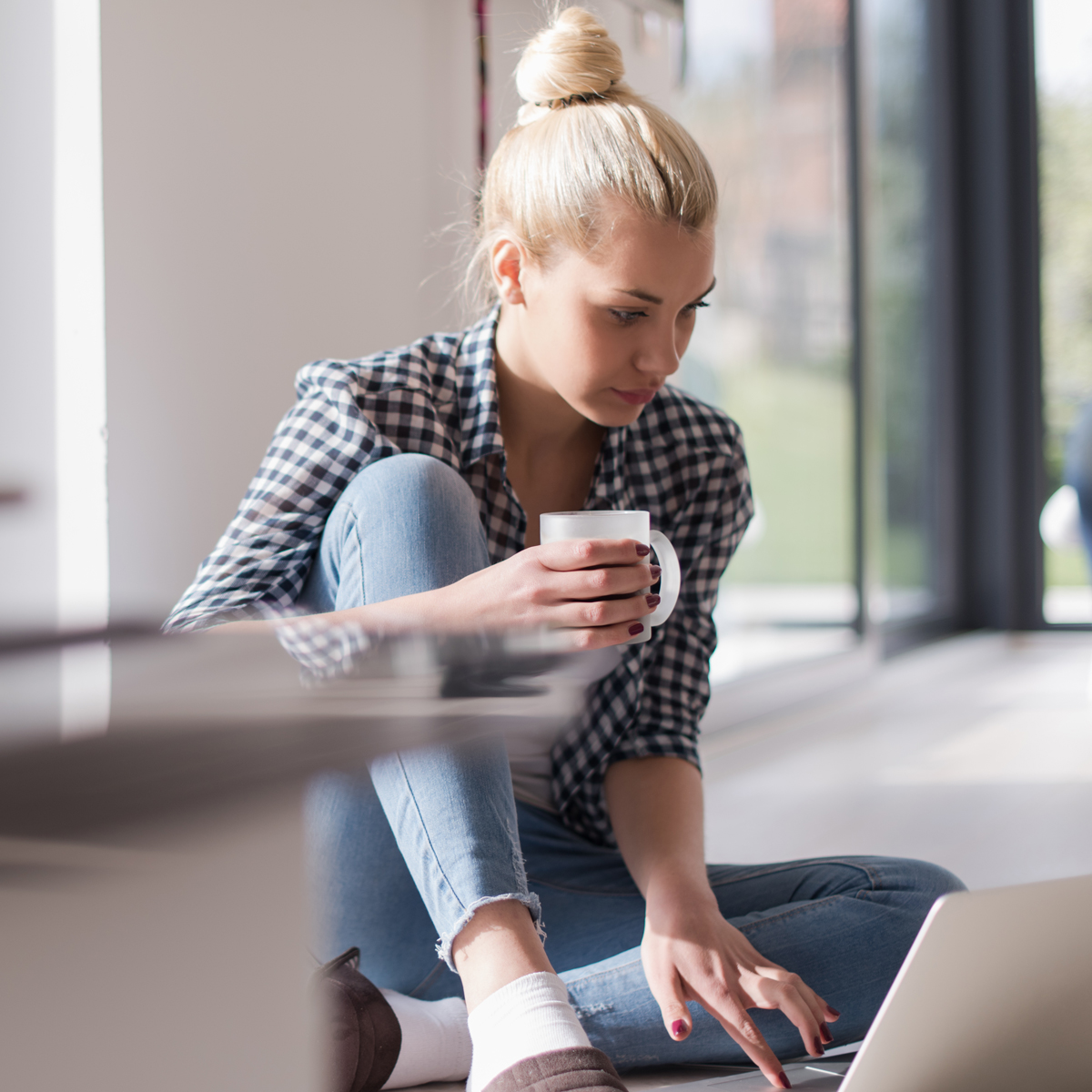 woman on laptop with coffee